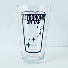 Load image into Gallery viewer, Astronomy on Tao logo pint glass empty, on a white nackground