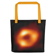 Load image into Gallery viewer, Digital mock up of a black tote bag with yellow handle printed with the Event Horizon Telescope image of the Sgr A* supermassive black hole in the Milky Way Galaxy.