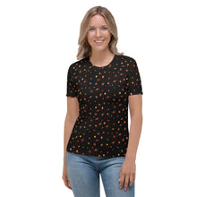 Load image into Gallery viewer, Digital mock-up front of t-shirt on model, round neck and short sleeves, black with small red and orange images of planet-forming disks at various angles.