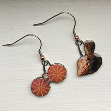 Load image into Gallery viewer, Mismatched earrngs made from upcycled paperboard, one an illustration of the Lucy mission soacecraft and the other binary asteroids in partial shadow, shown on a textured white earring display on a textured white background.
