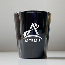 Load image into Gallery viewer, Black shot glass with white Artemis logo