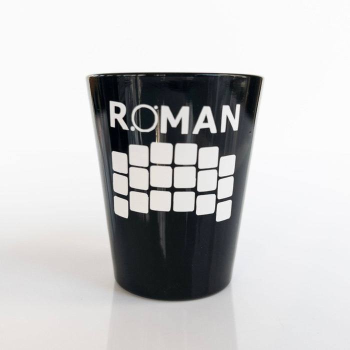 Black shot glass with 'ROMAN' and the detector array in white vinyl, shown on a white background