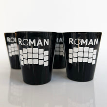 Load image into Gallery viewer, Four black shot glassed with &#39;ROMAN&#39; and the detector array in white vinyl, shown on a white background