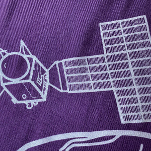illustration detail of the Psyche spacecraft solar panel in silver ink on a purple plush-weave scarf