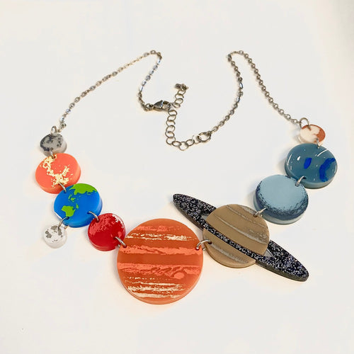 Solar System statement necklace in a white background
