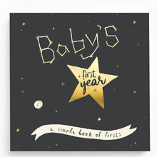 Load image into Gallery viewer, Book titled 'Baby's First Year' with gold stars and text on a dark background