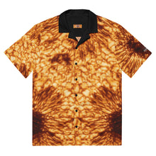 Load image into Gallery viewer, Digital mock up of a short-sleeve button shirt printed with the DKIST sunspot image (yellow/orange/black) with black collar and buttons, laid flat on a white background 