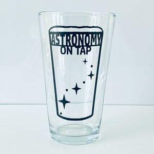 Astronomy on Tao logo pint glass empty, on a white nackground