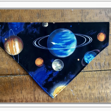 Load image into Gallery viewer, Solar system-themed bandana with planets on a wooden surface