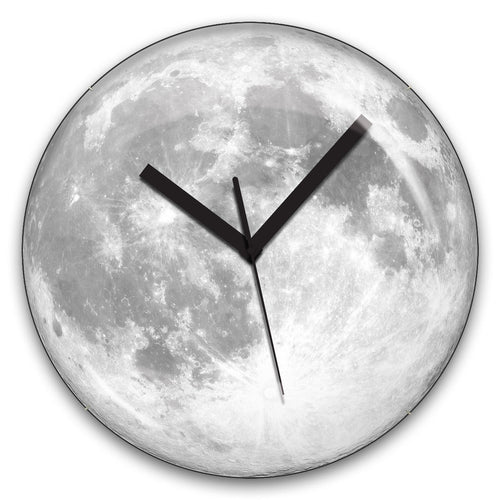 Glow in the dark moon image clock on white background