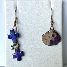 Load image into Gallery viewer, Mismatched earrngs made from upcycled paperboard, one an illustration of the Psyche mission soacecraft and the other the asteroid Psyche with two distinctive craters in partial shadow, shown hanging on a textured white earring display on a white background.