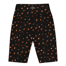Load image into Gallery viewer, Digital mock-up of the back of fitted shorts, black with small red and orange images of planet-forming disks at various angles. 