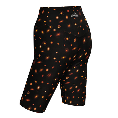 Digital mock-up of fitted shorts, black with small red and orange images of planet-forming disks at various angles. 