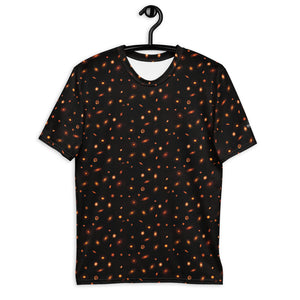 Digital mock-up of t-shirt front, black with small red and orange images of planet-forming disks at various angles. 