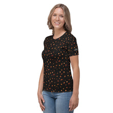 Load image into Gallery viewer, Digital mock-up front of t-shirt on model, round neck and short sleeves, black with small red and orange images of planet-forming disks at various angles, and Startorialist logo on left sleeve.