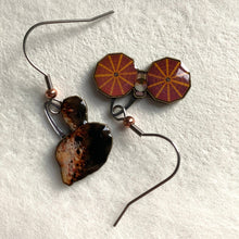 Load image into Gallery viewer, Mismatched earrngs made from upcycled paperboard, one an illustration of the Lucy mission soacecraft and the other binary asteroids in partial shadow, shown on a textured white earring display on a textured white background.
